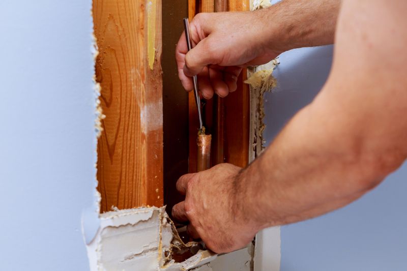 Plumber Repairing Pipe